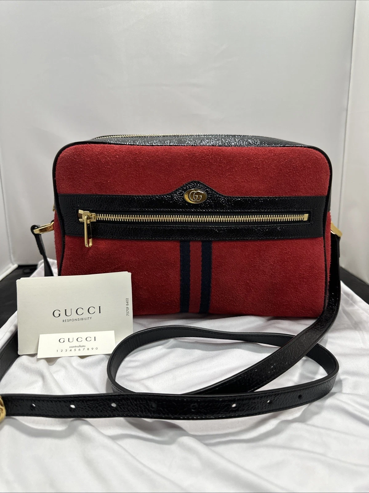 Red and black Gucci Ophidia crossbody bag with its shoulder strap and authenticity materials